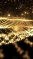 Abstract glowing golden waves of light forming a dynamic, shimmering surface with bokeh particles video