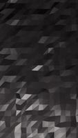 Abstract dark polygonal background with geometric low-poly texture and subtle lighting gradients video