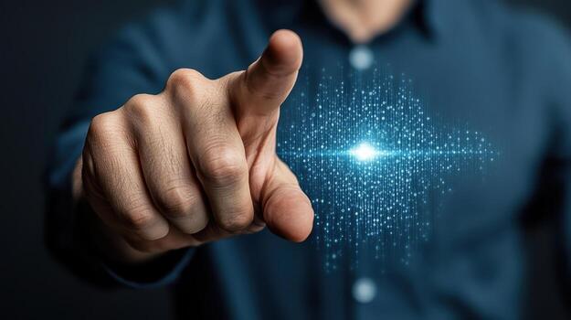 A man pointing at a glowing light on a screen photo