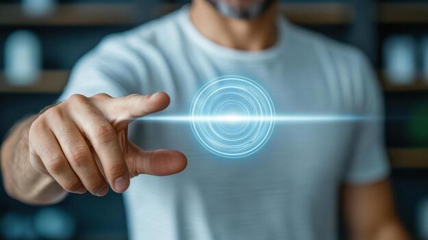 A man is touching a button with a circle on it photo