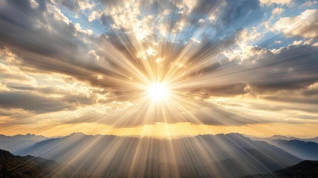 Sun shining over mountains and clouds photo