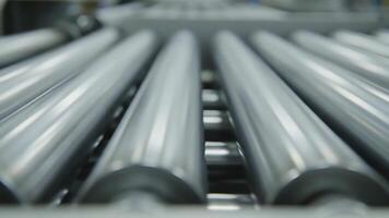 Industrial Conveyor Rollers in Motion - Automated Production Line Sequence. video