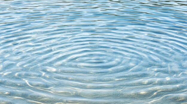 A circular pattern of ripples in the water photo