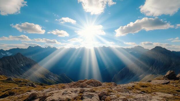 Sunbeams shining over mountains in the sky photo
