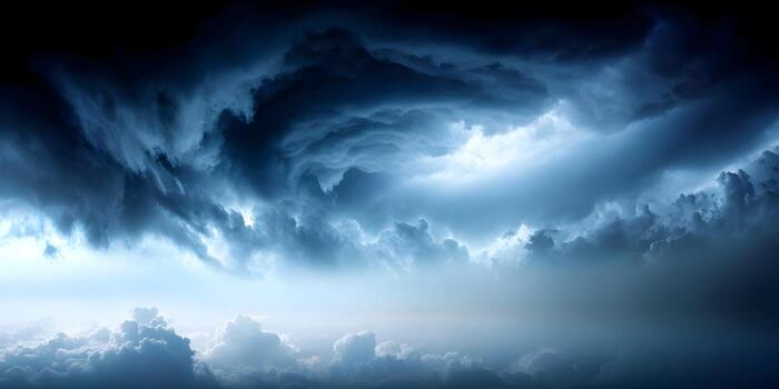 Intense dark storm clouds loom across the sky with striking light breaks creating a moody and powerful atmosphere photo