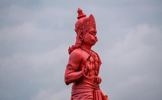 Red Hanuman Statue in Open Sky photo