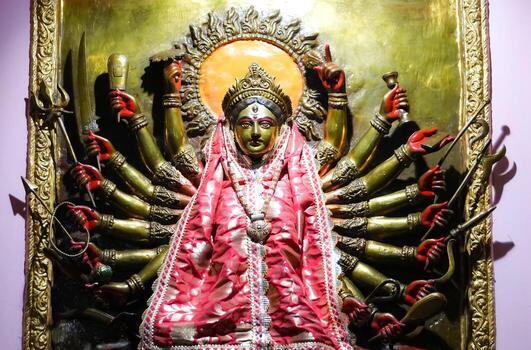 A statue of a goddess with many hands photo