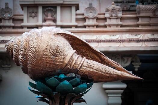 A large shell sculpture in front of a building photo