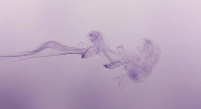 Abstract purple smoke trails gracefully flowing against a soft gradient background, creating a sense of ethereal movement and artistic expression photo
