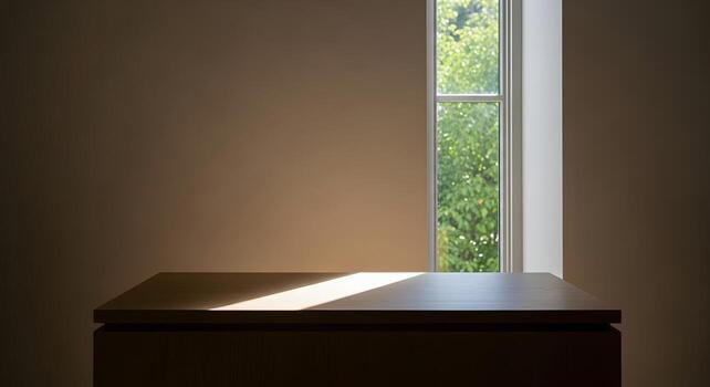 Sunlight streaming onto a minimalist wooden table by a window, highlighting the serene and peaceful atmosphere of an empty room, ideal for quiet contemplation or product display photo