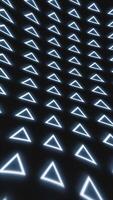 Abstract background with glowing blue triangles arranged in a seamless futuristic grid pattern on a dark surface video
