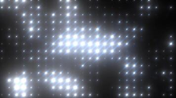 Abstract glowing white disco wall with illuminated dots and sparkling rays creating futuristic brilliance video