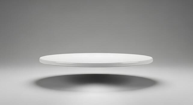 White Circular Podium Floating in a Minimalist Studio Environment with a Soft Shadow photo