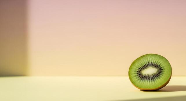 Close-up of a vibrant, ripe kiwi fruit slice on a gradient background with soft shadows photo