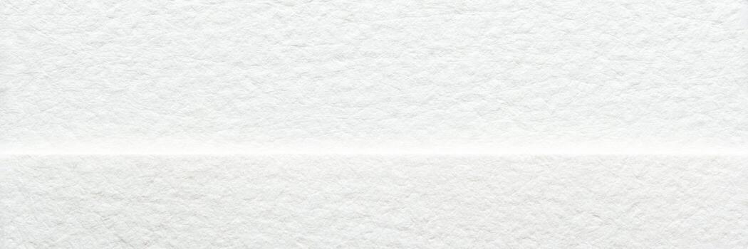 White textured paper background with subtle horizontal line and fibrous surface details. photo