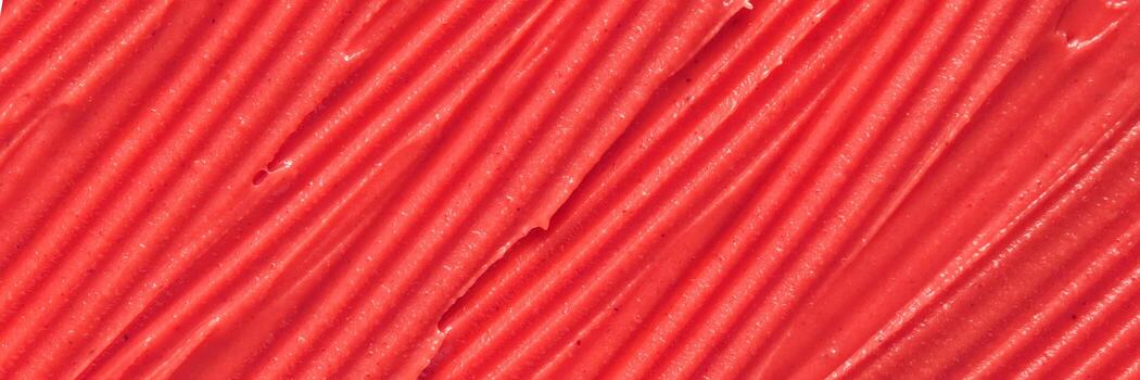 Close-up view of textured red background with grooves and patterns. photo