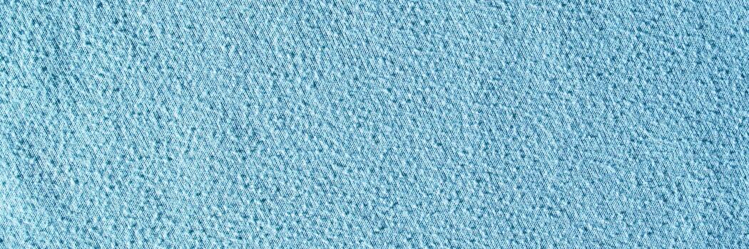 Light blue textured paper surface background with subtle patterns and rough finish. photo