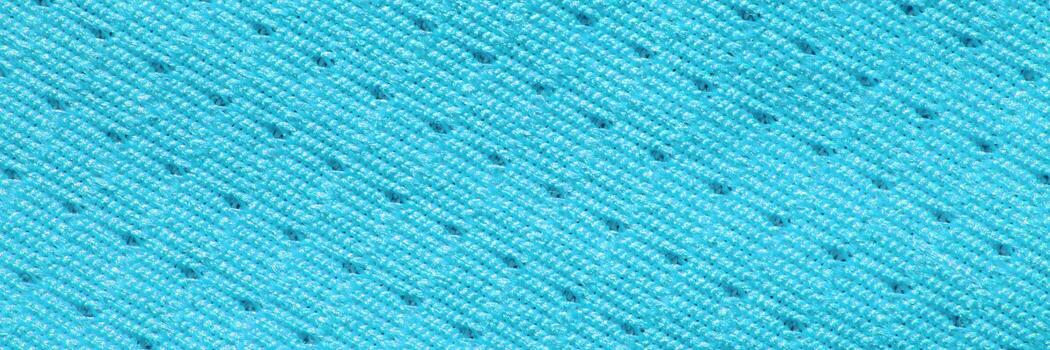 Close-up of blue fabric texture with interlocking pattern and subtle shadows. photo