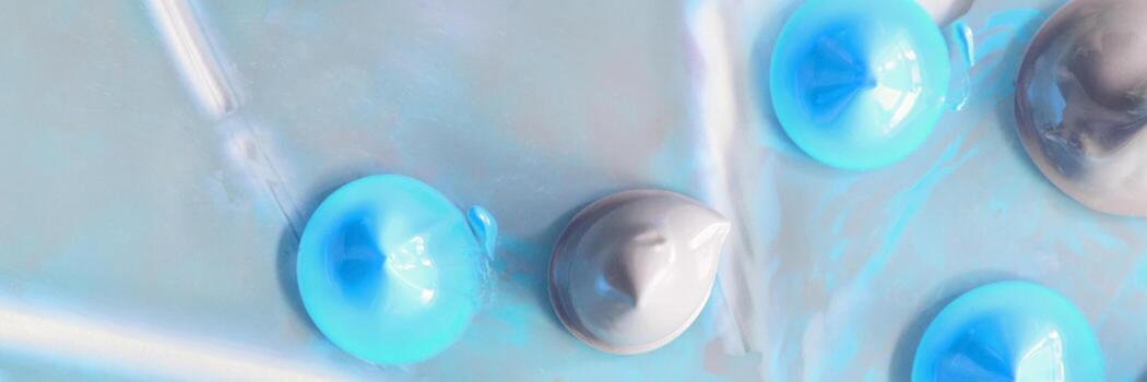 Abstract blue and gray 3d spheres on iridescent background creating a futuristic and hypnotic visual effect. photo