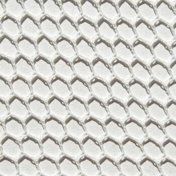 Close-up of textured white honeycomb pattern background with geometric hexagonal design. photo