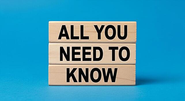 Wooden blocks displaying All You Need To Know on a vibrant blue background representing essential information and knowledge conveying a sense of clarity and understanding for educational or informatio photo