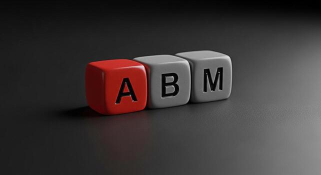 Closeup of three colorful dice spelling out ABM on a dark textured surface representing accountbased marketing strategy and a focused targeted approach to business growth and success in a corporate en photo