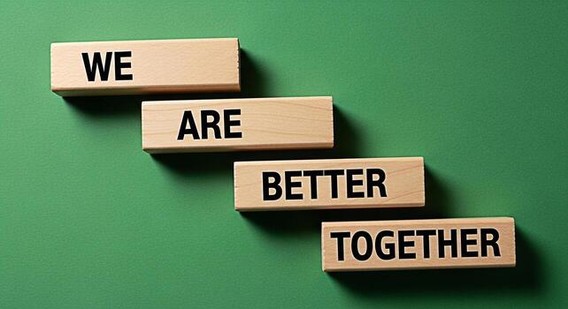 Wooden blocks displaying the message We Are Better Together on a green background symbolizing teamwork collaboration and the positive impact of unity in achieving common goals and fostering photo