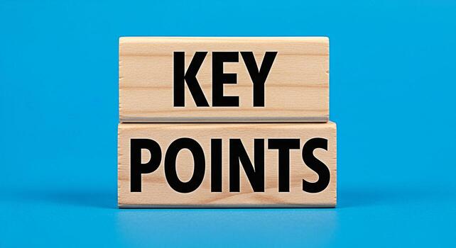Stacked wooden blocks displaying the words Key Points on a bright blue background emphasizing essential information and critical elements for effective communication and strategic planning conveying c photo