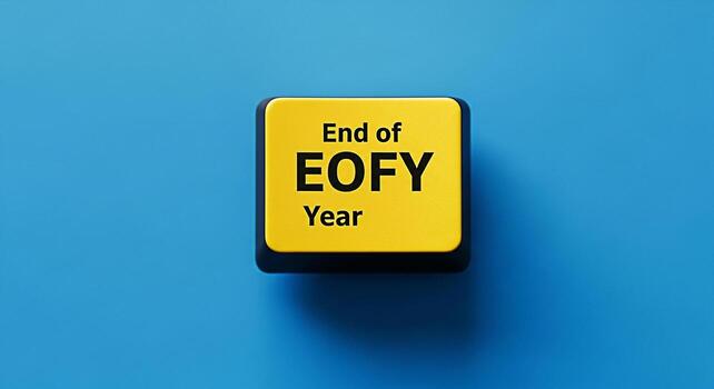 Closeup of a yellow keyboard button displaying End of EOFY Year against a vibrant blue background symbolizing the conclusion of the financial year and the anticipation of new beginnings in business an photo