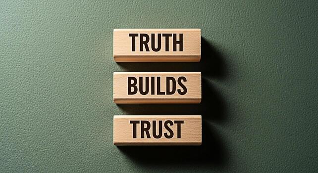 Wooden blocks displaying Truth Builds Trust on a textured green background symbolizing integrity reliability and the importance of honesty in building strong relationships and fostering a trustworthy photo