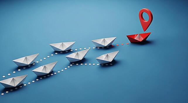 Paper boats navigate towards a red destination marker on a blue background symbolizing leadership direction and strategic planning with a focus on achieving goals and reaching the intended target photo