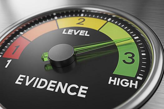 Closeup of an evidence level gauge indicating a high level of proof and validation set against a brushed metal background conveying a sense of accuracy reliability and confidence in research and data photo