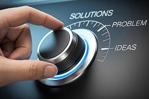 Closeup of a hand turning a dial from Problem towards Solutions and Ideas on a sleek modern device symbolizing innovation problemsolving and the pursuit of creative solutions in a technological enviro photo