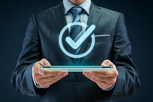 Confident businessman in a suit holding a transparent tablet with a glowing checkmark symbolizing approval and success in a modern corporate environment representing efficiency and reliability photo