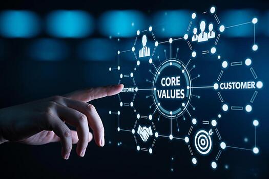 Human hand interacting with a digital interface displaying core values customer focus teamwork and target achievement in a futuristic hightech environment symbolizing business ethics and strategic pla photo