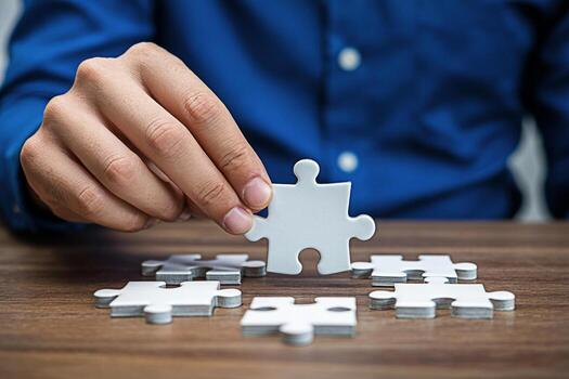 Focused hand completing a jigsaw puzzle on a wooden table symbolizing problemsolving and strategic thinking in a business context conveying a sense of accomplishment and teamwork photo