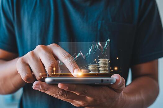 Closeup of a man analyzing financial data on his smartphone with stacks of coins showcasing investment growth and wealth management in a modern techdriven financial landscape emphasizing success and p photo