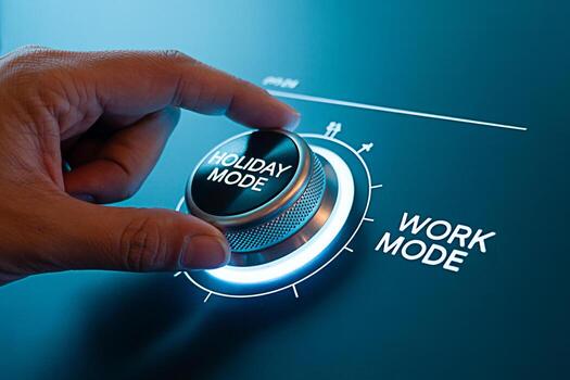 Close-up of a hand switching a knob from Work Mode to Holiday Mode on a futuristic interface symbolizing the transition from professional life to vacation and relaxation with a focus on work-life bala photo