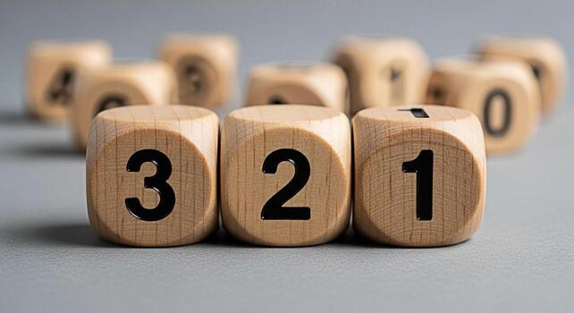 Closeup of wooden number blocks displaying 3 2 and 1 on a gray surface representing countdown sequence and ordering creating a sense of anticipation and numerical progression in a minimalist setting photo