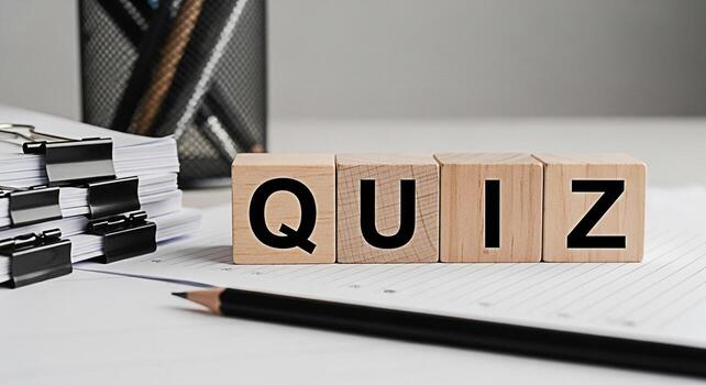 Wooden blocks spelling QUIZ on a desk with papers and a pencil representing a test or challenge in an educational or business setting conveying a sense of anticipation and intellectual engagement photo