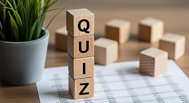 Wooden blocks spelling QUIZ stacked on a financial document in a bright office setting symbolizing knowledge assessment and interactive learning in a business environment promoting engagement and educ photo