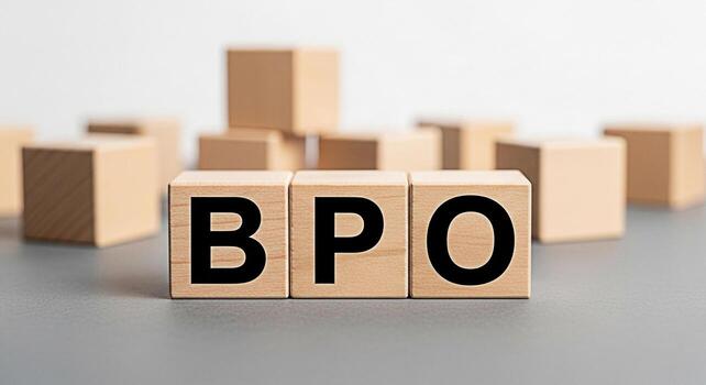 Wooden blocks displaying the acronym BPO representing Business Process Outsourcing in a minimalist office setting symbolizing efficiency and strategic business solutions for enhanced operational perfo photo