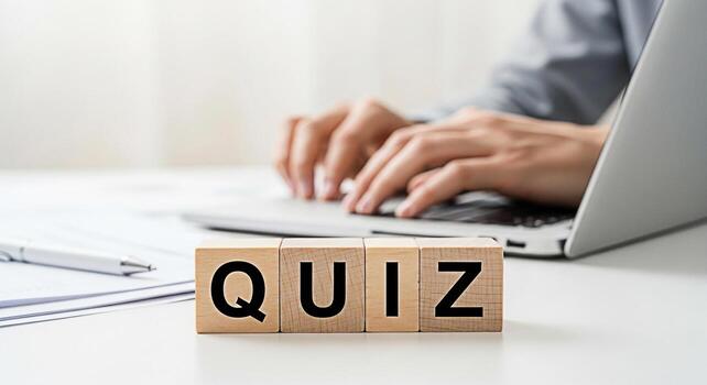 Person taking an online quiz on a laptop in a bright modern office emphasizing education learning and assessment with wooden blocks spelling QUIZ in the foreground creating a focused and intellectual photo