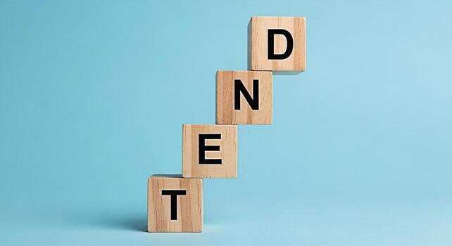 Wooden blocks spelling END stacked on a blue surface symbolizing the conclusion of a project the final stage or the completion of a goal conveying a sense of accomplishment and closure photo