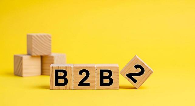 Wooden blocks displaying B2B on a vibrant yellow background symbolizing businesstobusiness transactions and partnerships creating a bright and optimistic mood for corporate growth and success photo