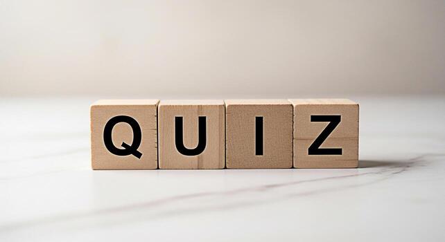 Wooden blocks spelling QUIZ on a marble surface representing a test of knowledge and skills creating a sense of challenge and intellectual curiosity in an educational setting photo