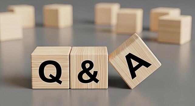 Wooden blocks displaying Q A on a gray surface representing a question and answer session symbolizing knowledge learning and the importance of information exchange in a clear and concise manner photo