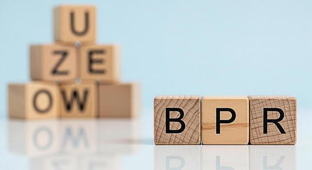 Wooden blocks spelling out BPR in a bright studio environment representing Business Process Reengineering and organizational change conveying a message of innovation and strategic improvement photo