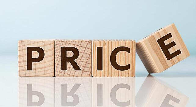 Wooden blocks spelling PRICE on a reflective surface against a light blue background representing cost value and financial considerations in a clear and concise manner ideal for business and marketing photo