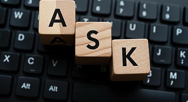 Wooden blocks spelling ASK on a black computer keyboard symbolizing questions and information seeking in a digital environment conveying a message of inquiry and problemsolving in the modern age photo